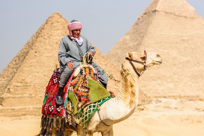 Discover Giza: Pyramids, Sphinx Tour with Lunch & Camel Adventure - First Stop: The Giza Plateau and the Big Three Pyramids