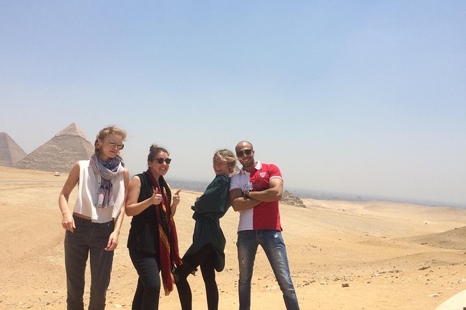 Full Day Tour Giza Pyramids, Sphinx, Egyptian Museum and Khan El Khalili Bazaar - Stop 1: Giza Pyramids and Sphinx, plus Solar Boat Museum and Mummification Temple
