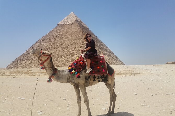Full-Day Tour to Giza Pyramids, Memphis, and Saqqara with lunch - Stop 1: The Pyramids of Giza, Sphinx, Solar Boat, and Camel Time