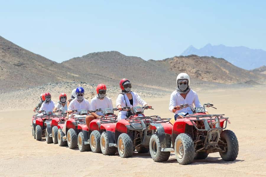 Hurghada: Egypt Quad Bike Safari Excursion Hurghada - Riding among mountains and arriving at a Bedouin village